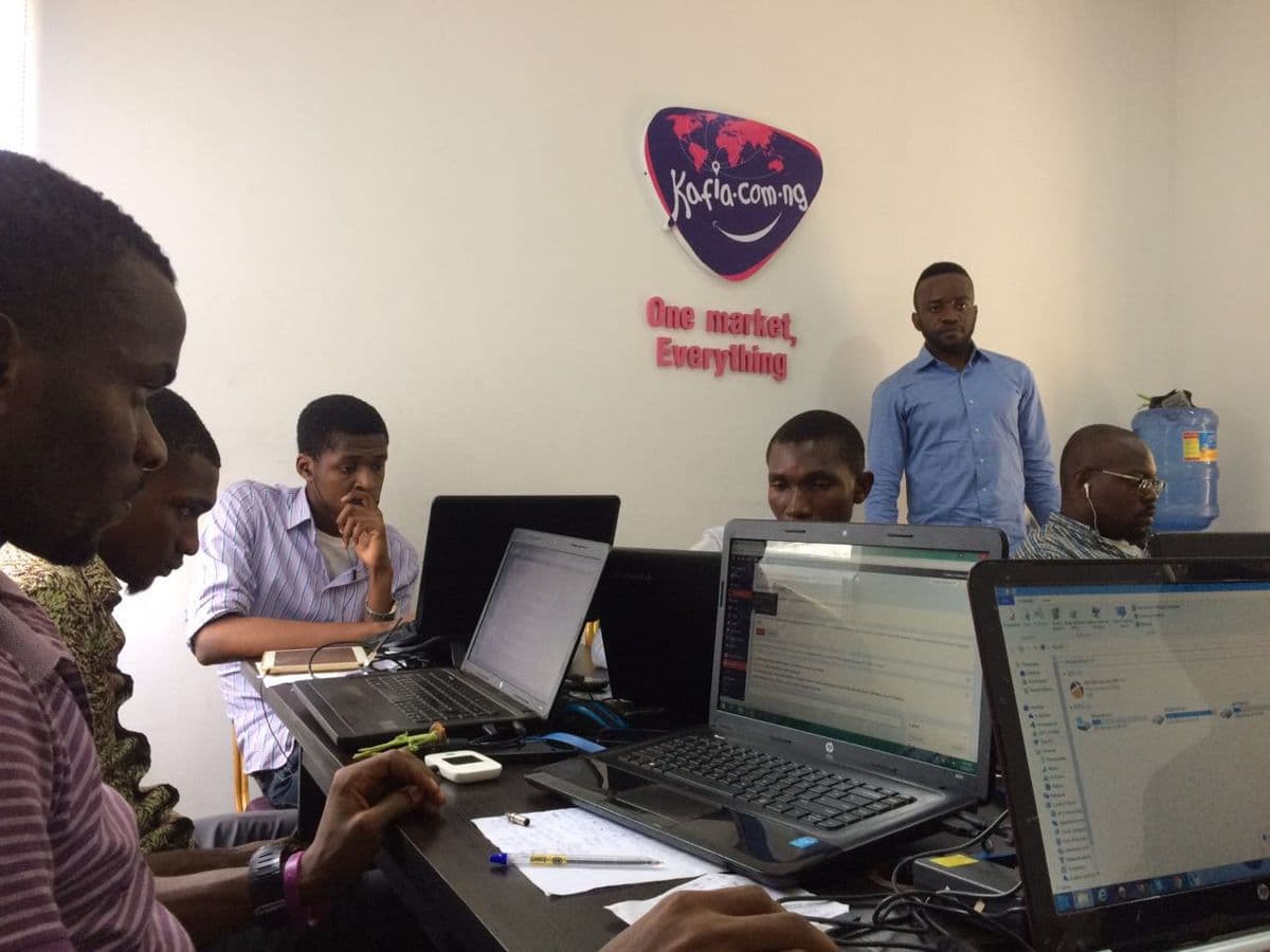 People working at computers in an office in Africa.