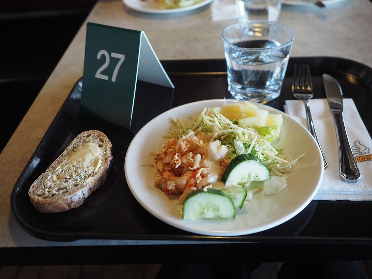 A served meal on a restaurant tray with a table number.
